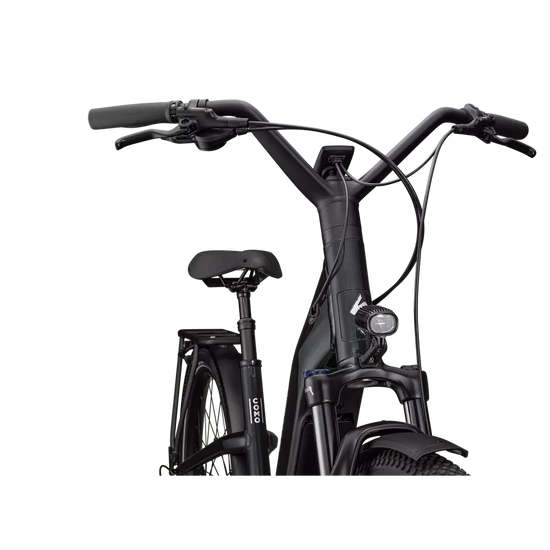 Musta Specialized Como 4.0 -sähköpyörä ohjaustasolla ja etuvalolla